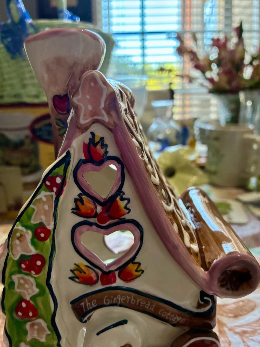 Blue Sky “The Gingerbread Cottage”. In new condition. Pink, brown, red & green.